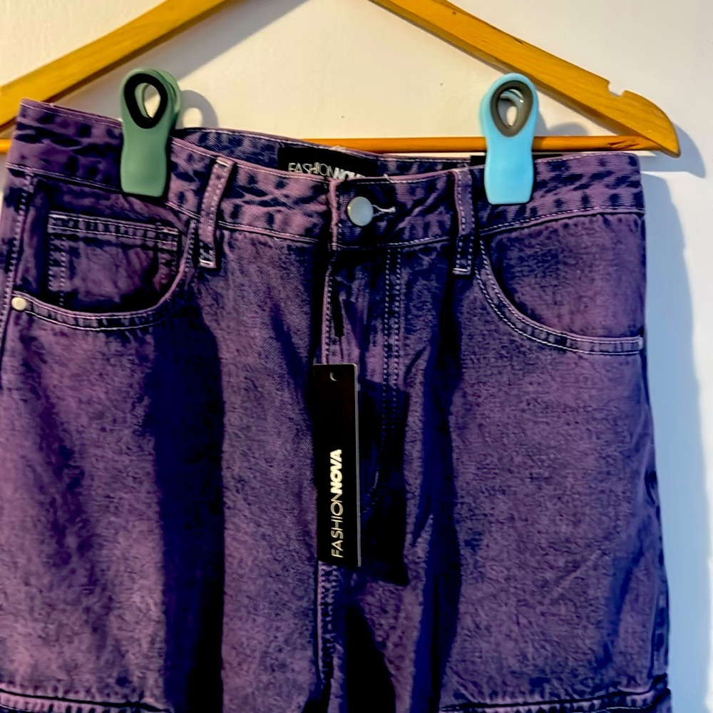 These are brand new Fashion Nova jeans in size 9, featuring a deep purple color